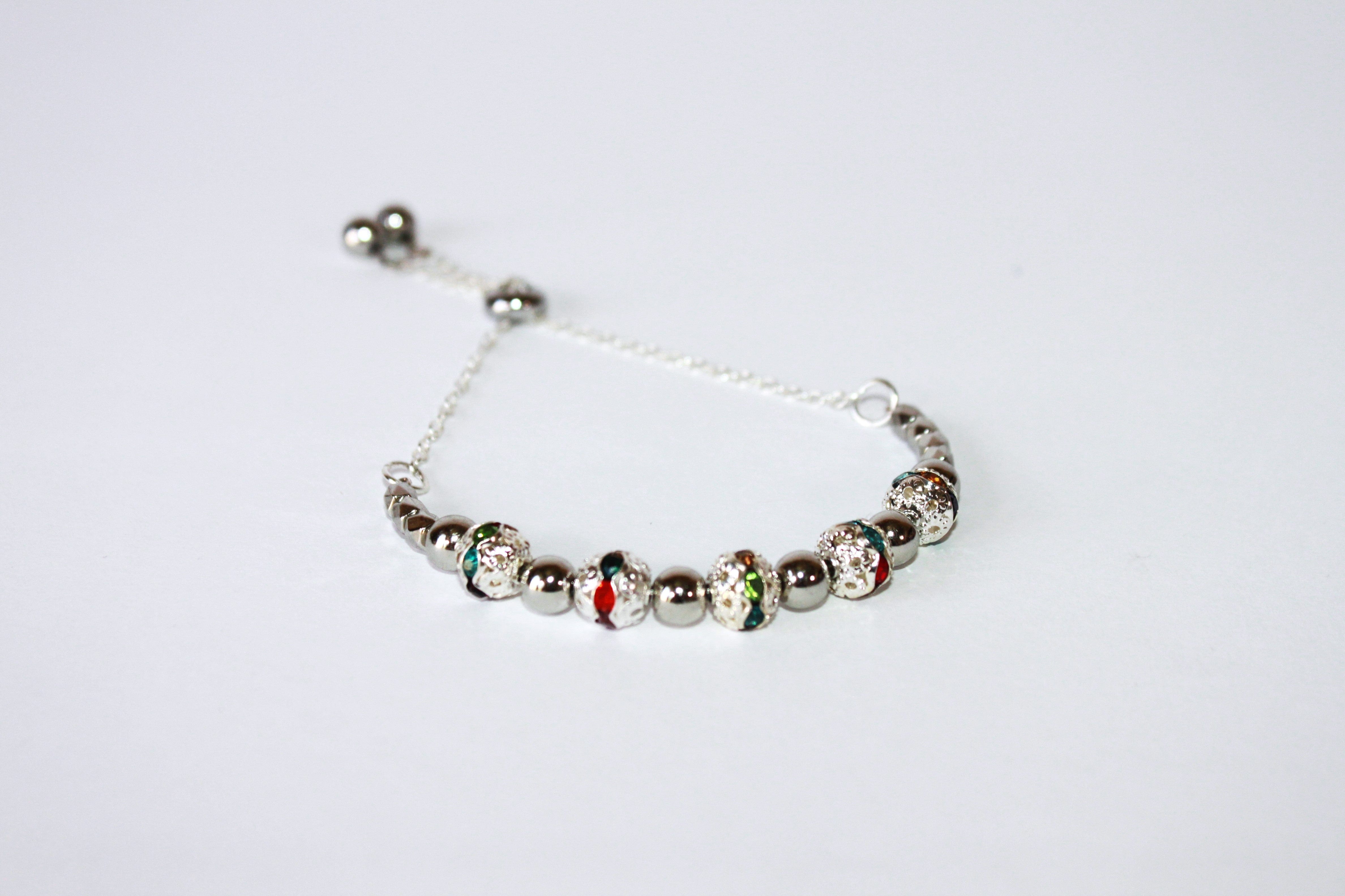 Hand-crafted stainless steel and crystal adjustable bracelet - Available in various colors.