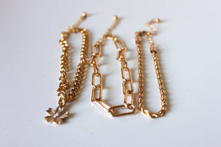 Bracelet - 3 gold bracelets - layer style. Paper clip, rope and cable chain designs w/charms - 6.5" JL066