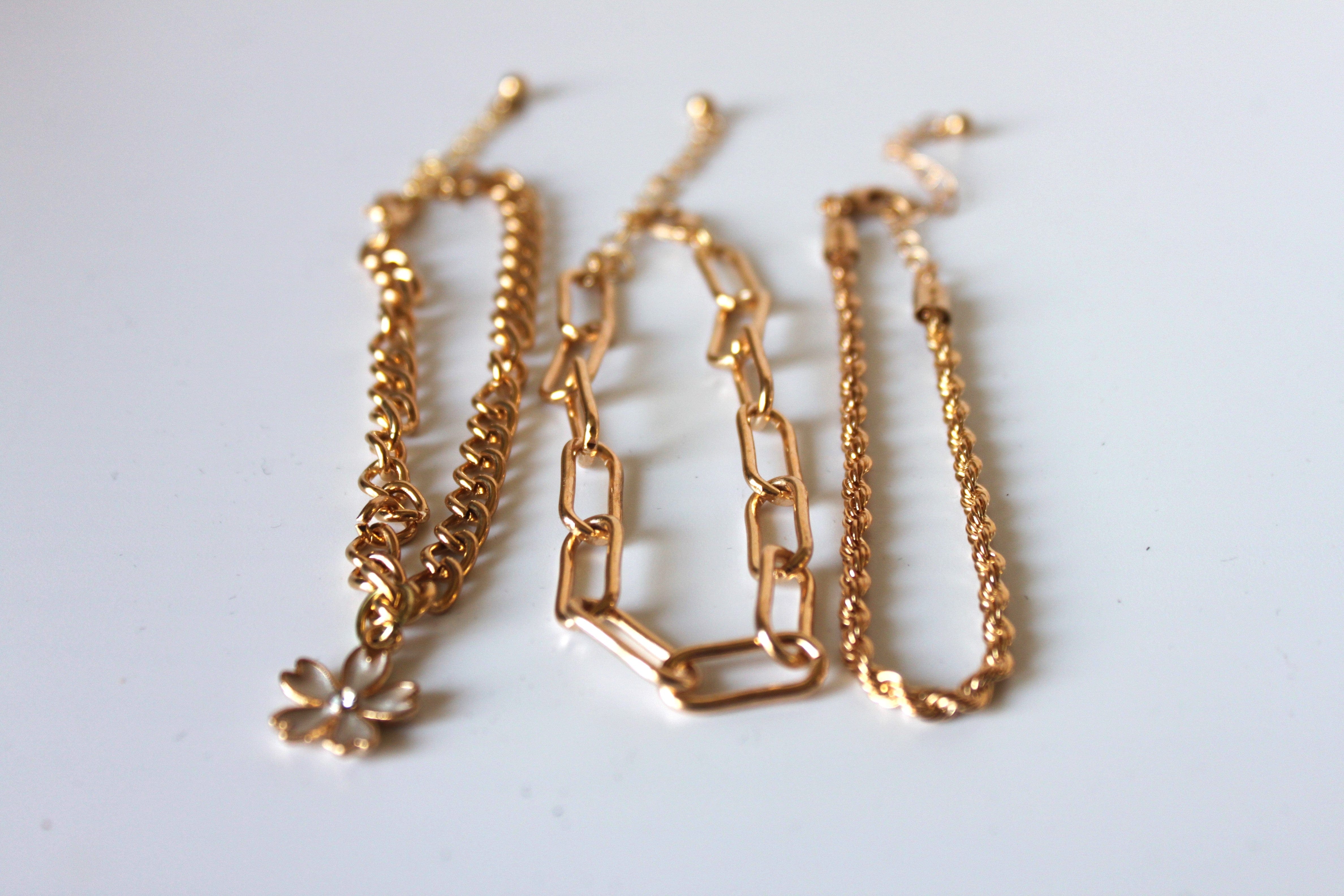 Bracelet - 3 gold bracelets - layer style. Paper clip, rope and cable chain designs w/charms - 6.5" JL066