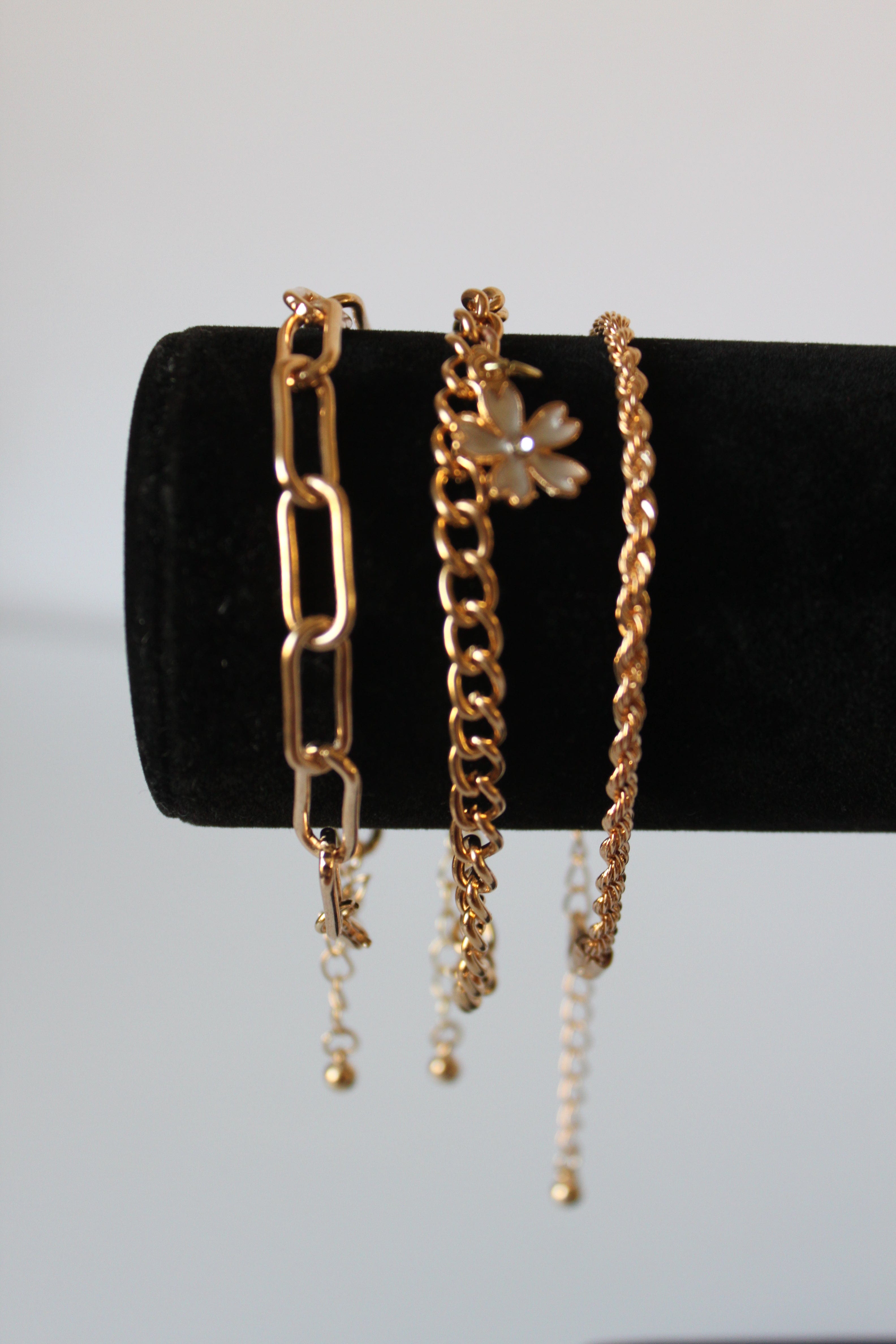 Bracelet - 3 gold bracelets - layer style. Paper clip, rope and cable chain designs w/charms - 6.5" JL066