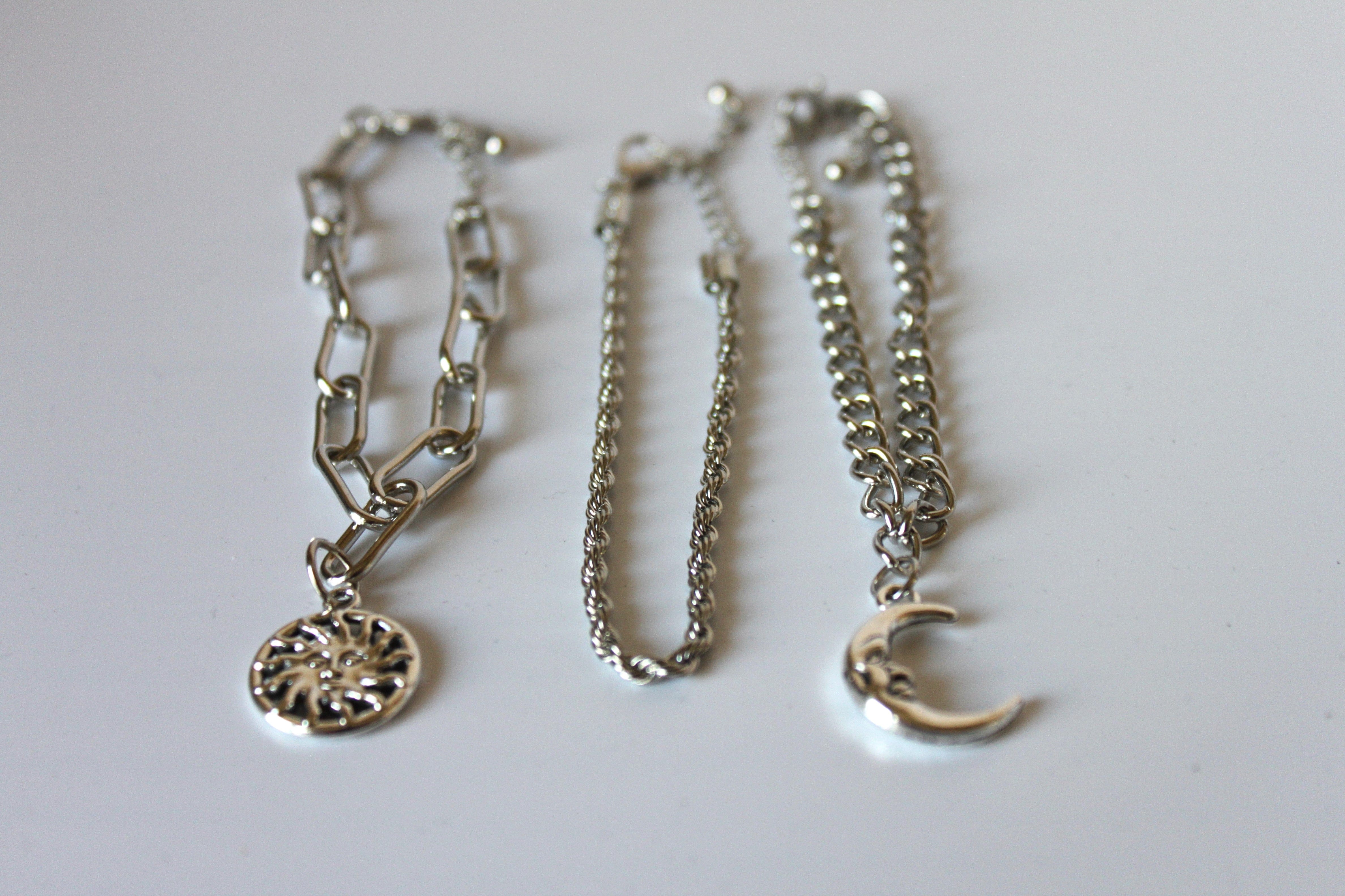 Bracelet - 3 silver bracelets - layer style. Paper clip, rope and cable chain designs w/moon & sun charms- 6.5" w/extensions JL068