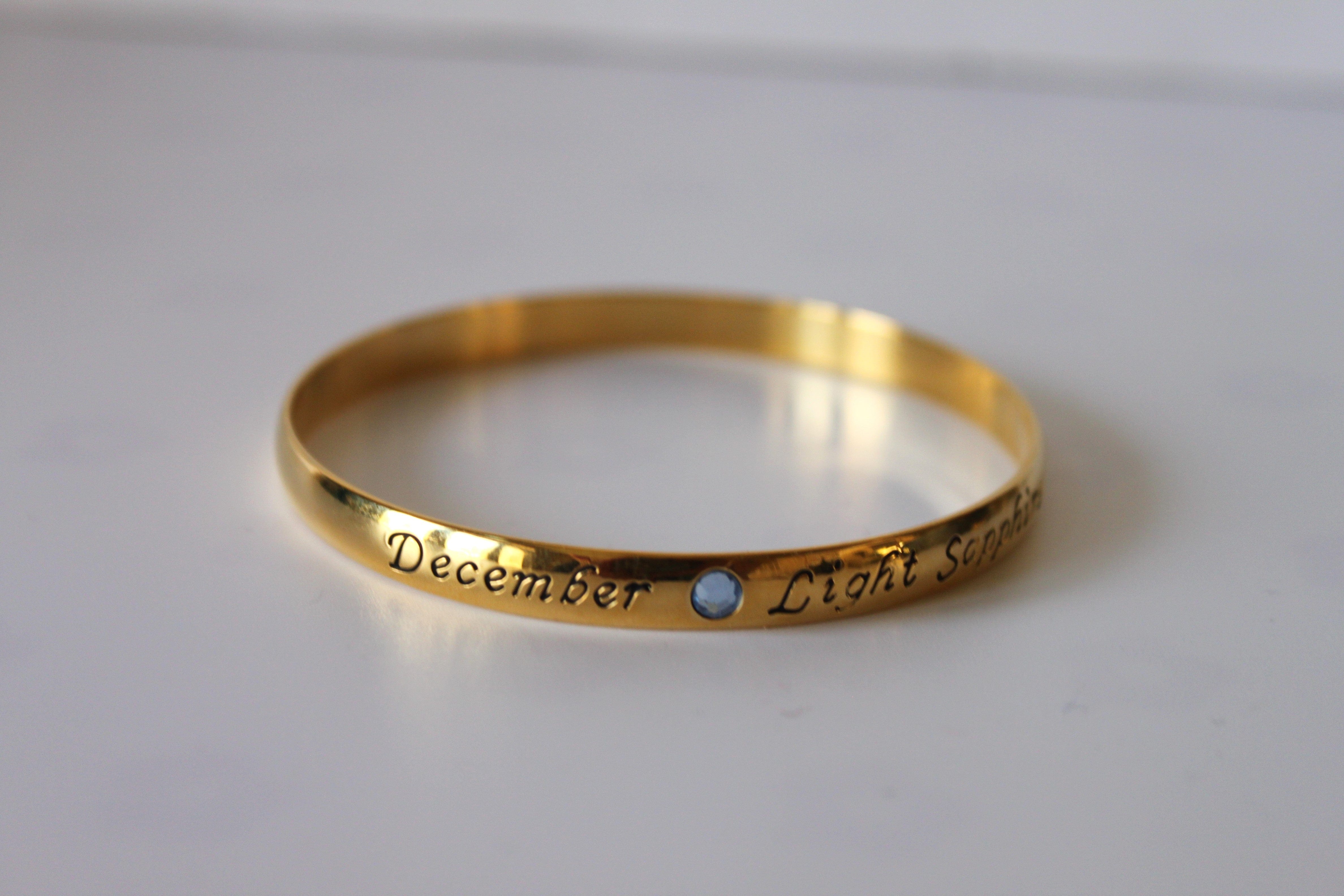 Bracelet - Gold bangle- December inscription with light blue sapphire gemstone JL038