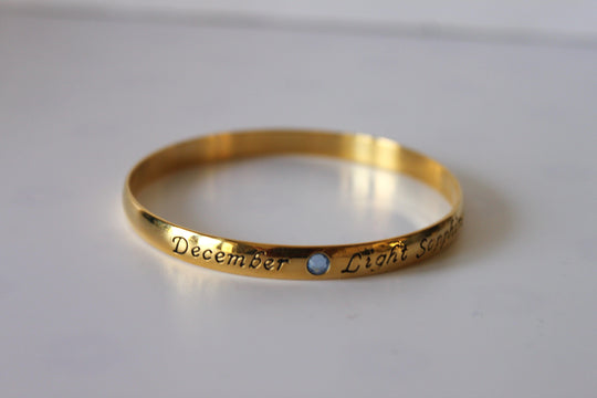 Bracelet - Gold bangle- December inscription with light blue sapphire gemstone JL038