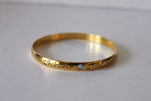 Load image into Gallery viewer, Bracelet - Gold bangle- December inscription with light blue sapphire gemstone JL038
