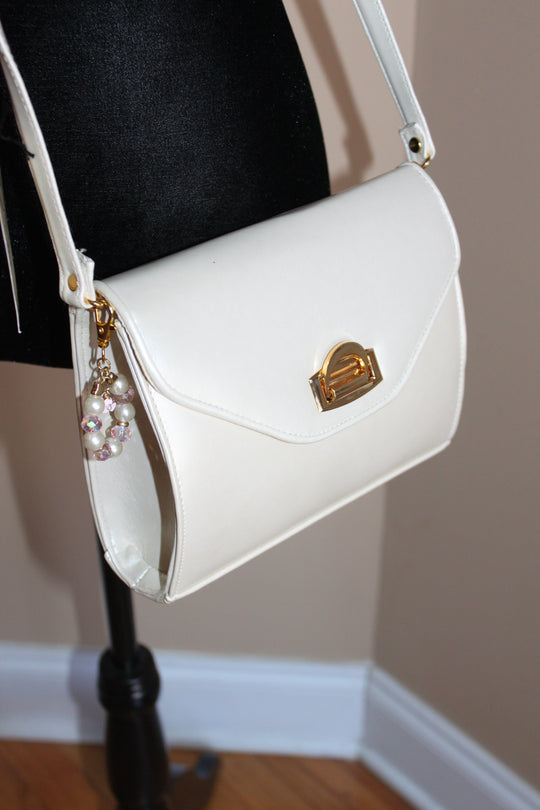 Cream & Gold crossbody handbag w/adjustable strap & bag charm - NEW