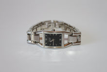 Load image into Gallery viewer, Women&#39;s Silver Nine West Watch, Black Face in Stainless Steel - size 6.5&quot;
